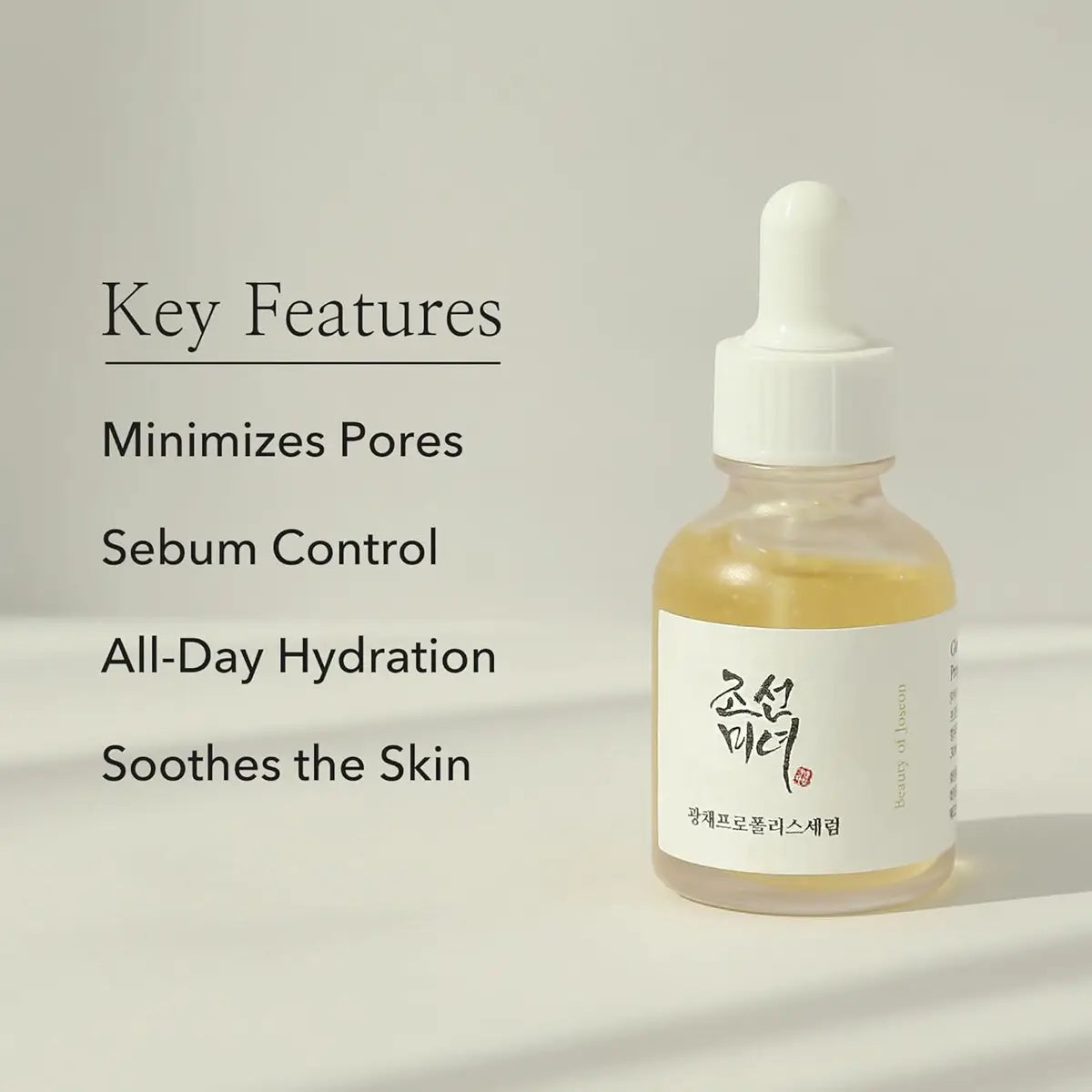 Skincare dropper bottle with key features listed on a light background