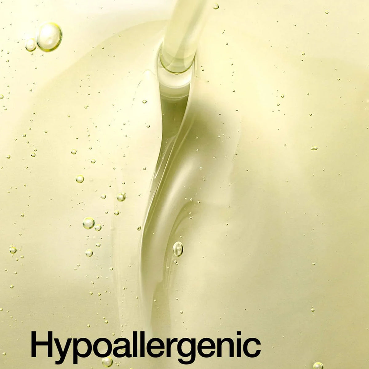 Hypoallergenic text on a close-up of a liquid with bubbles