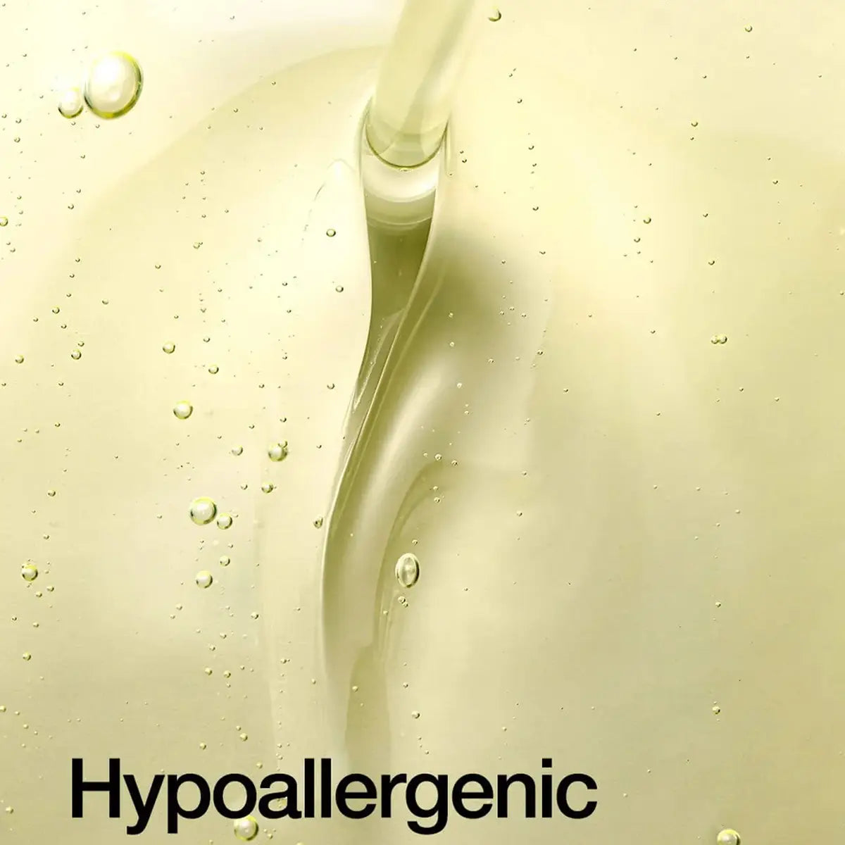 Hypoallergenic text overlay on a close-up of a liquid with bubbles