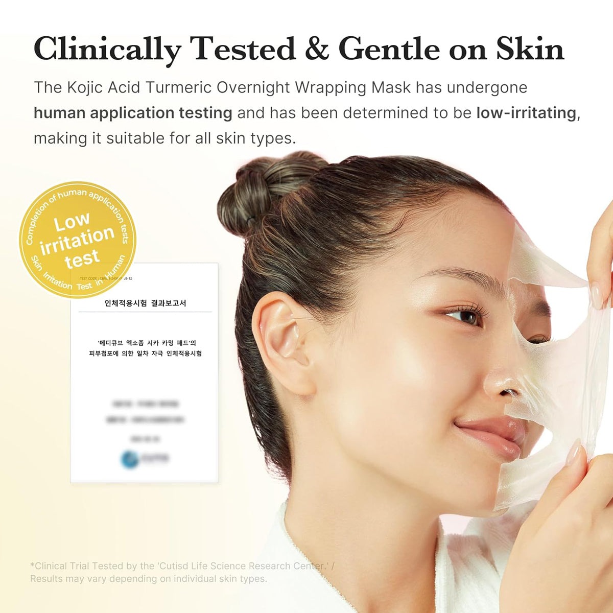 Woman wearing a face mask with text about clinical testing and skin compatibility.