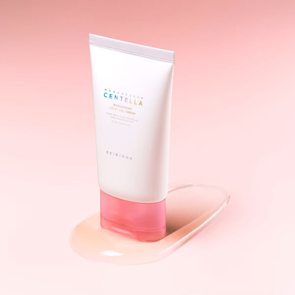 Skincare tube with pink base on a gradient pink background