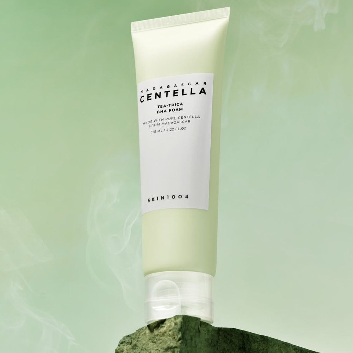 Skincare tube with 'MADAGASCAR CENTELLA' text on a green background