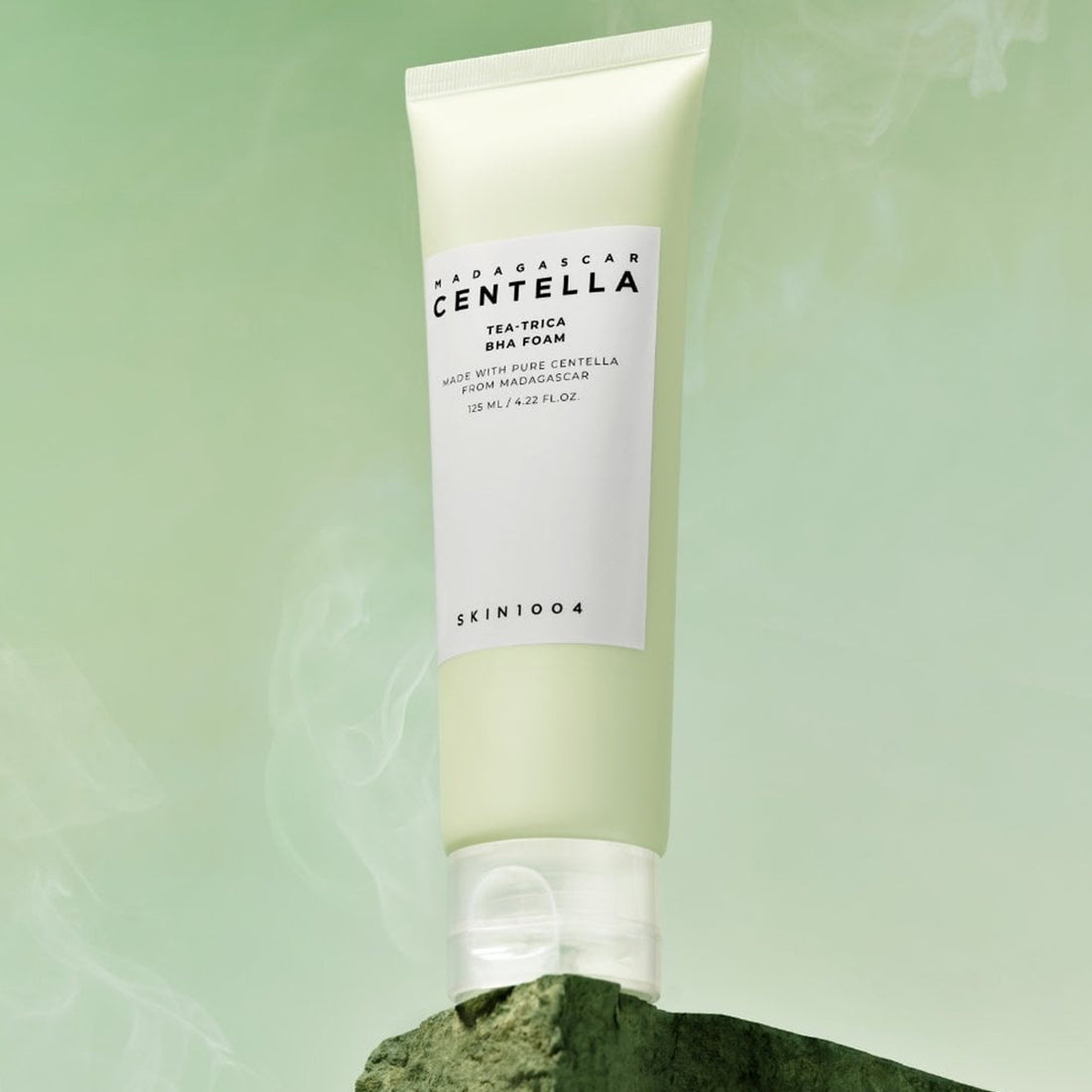 Skincare tube with 'MADAGASCAR CENTELLA' text on a green background