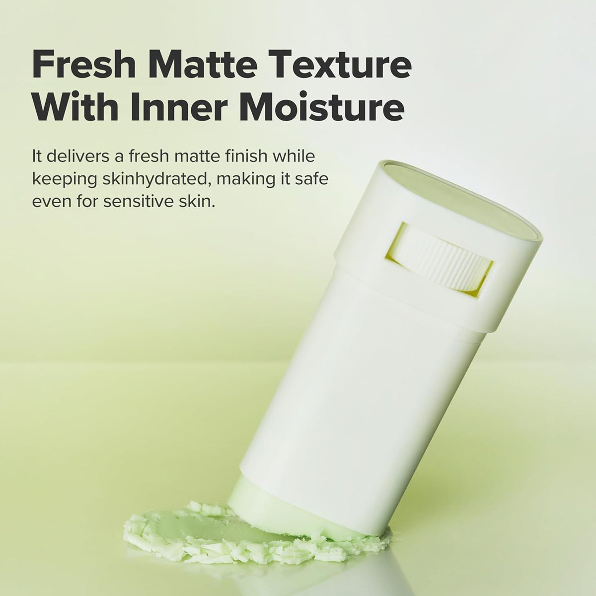 Cosmetic stick with text about fresh matte texture and inner moisture on a light green background