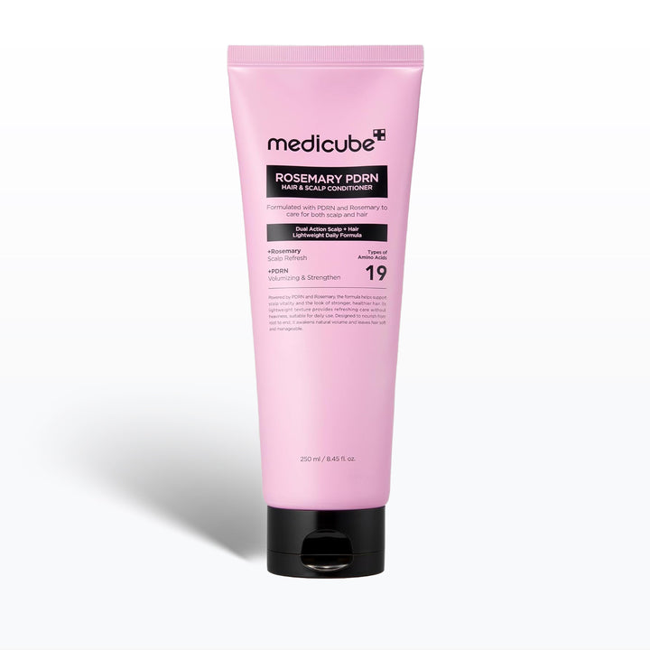 Pink tube of Medicube Rosemary PDRN hair and scalp conditioner on a white background