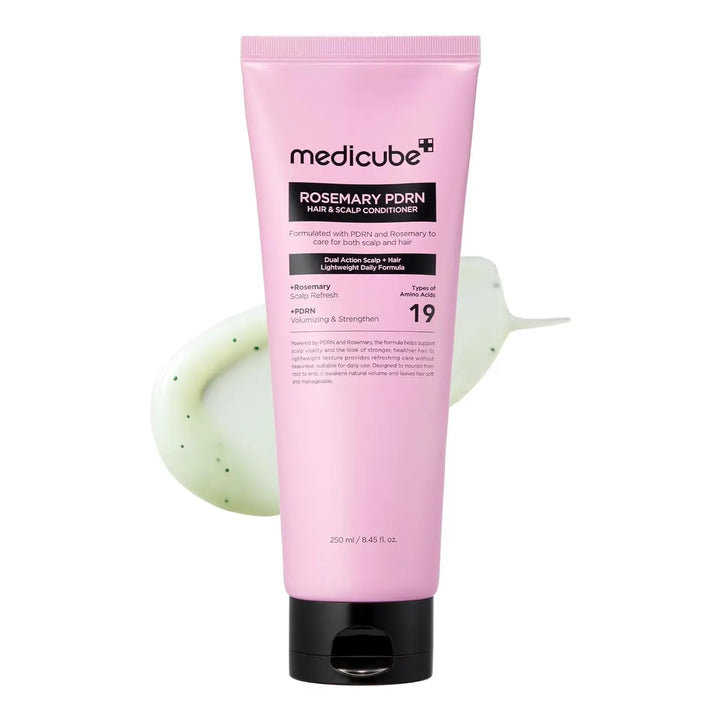 Pink tube of Medicube Rosemary PDRN hair and scalp conditioner on a white background