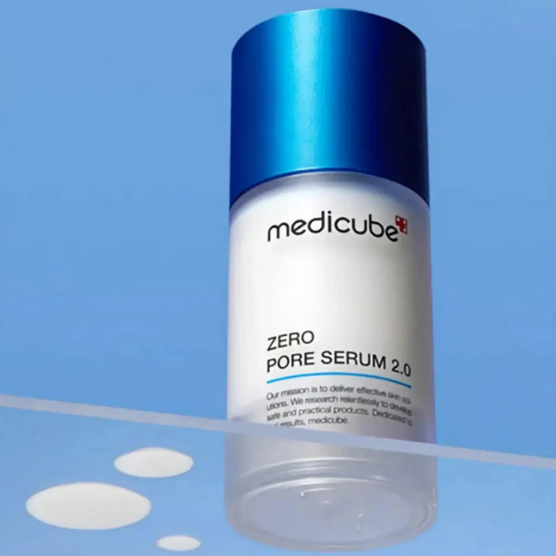 Medicube Zero Pore Serum 2.0 bottle on a blue background