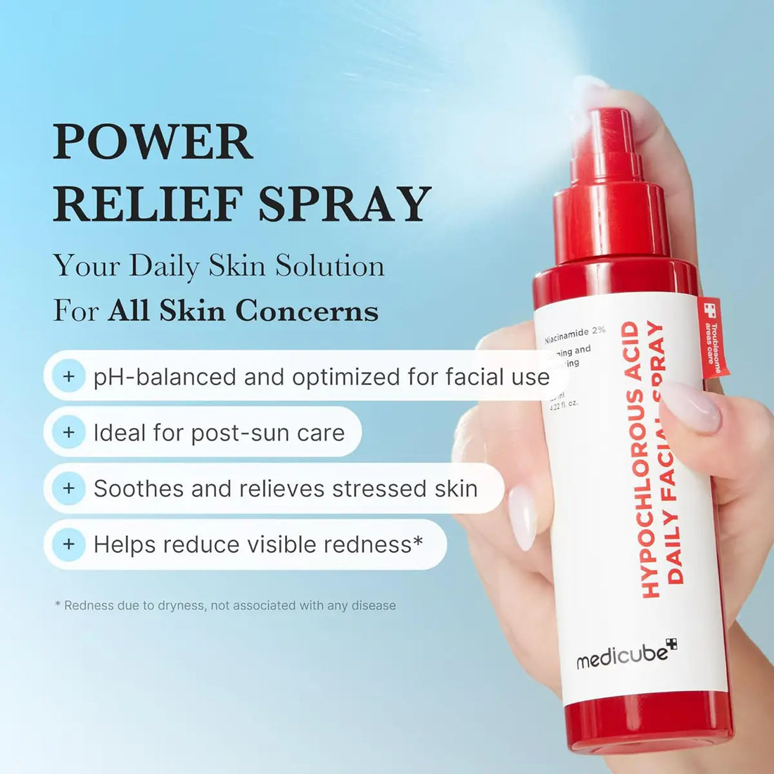Hand holding a skin care spray bottle with product details on a blue background