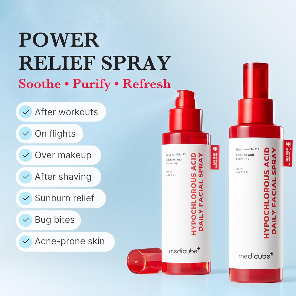 Two red and white bottles of medicube daily facial spray on a light blue background with text about product uses.