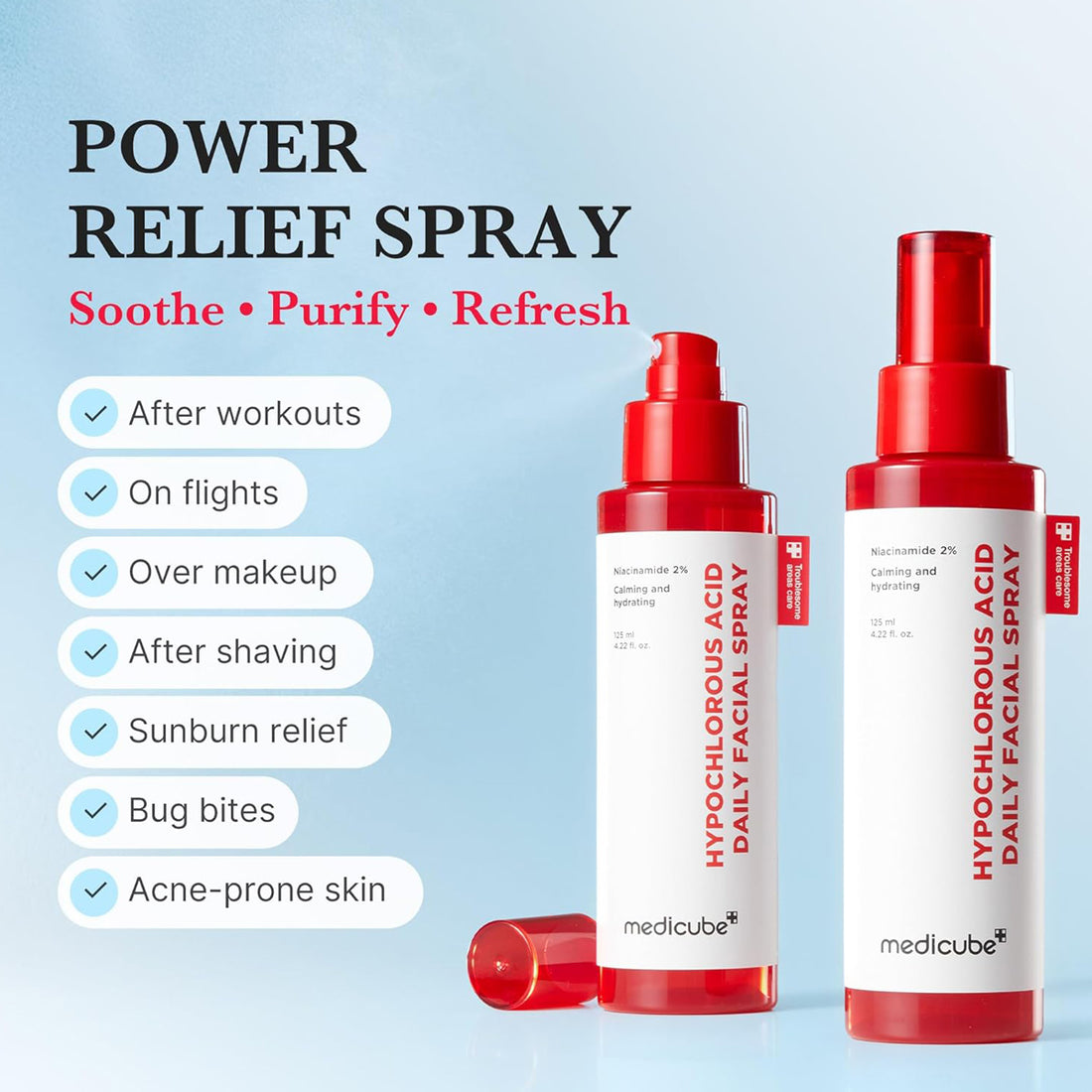 Two red and white bottles of medicube daily facial spray on a light blue background with text about product uses.