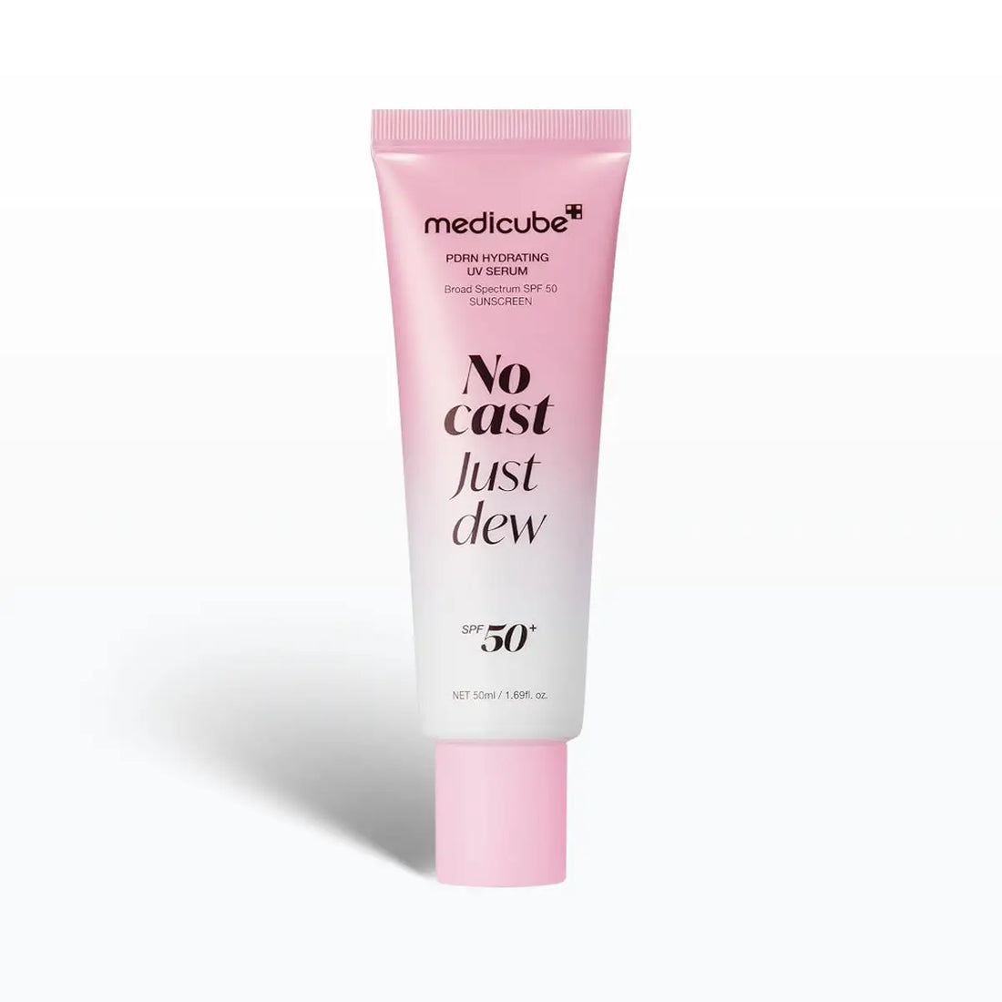 A pink and white squeeze tube of medicube No Cast Just Dew SPF 50+ dewy hydrating UV serum, shown on a clean white background with a soft shadow.