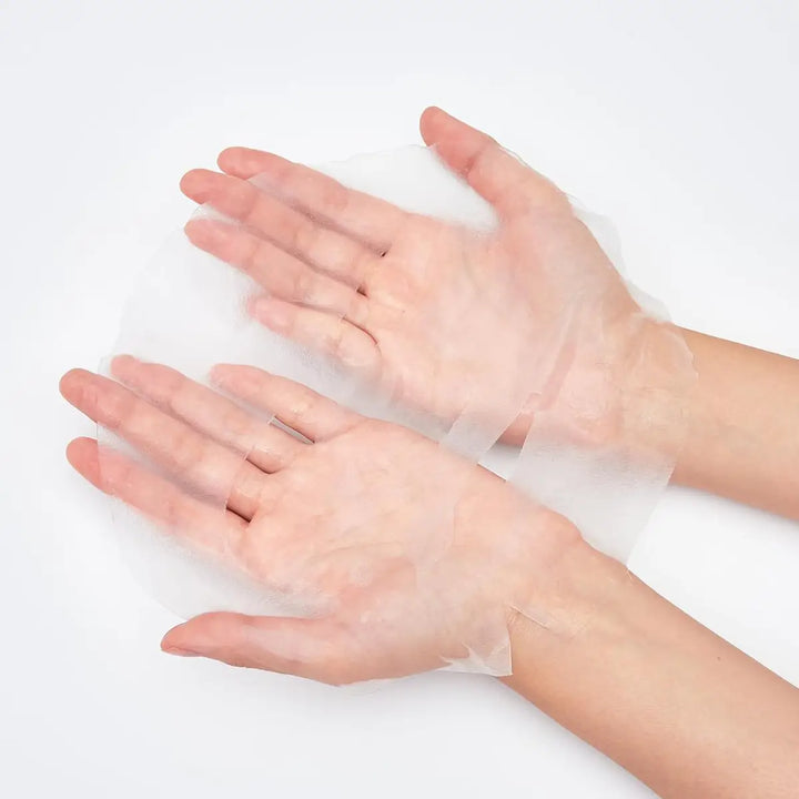 Missha Airy Fit Sheet Mask Pearl 19g held between hands, showcasing its ultra-thin design and hydration properties.