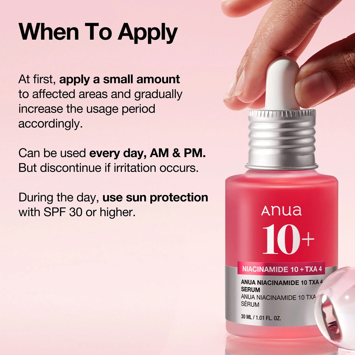 Anua skincare serum bottle with application instructions on a pink background