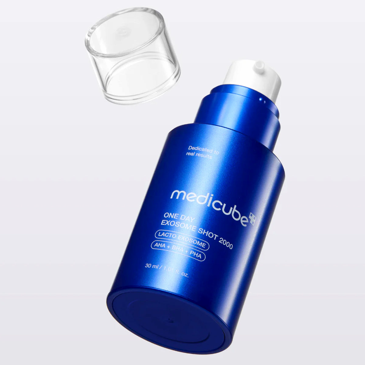 Blue skincare serum bottle with white cap on a light gray background