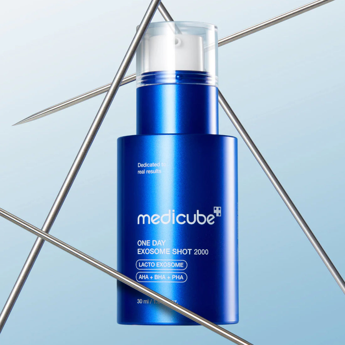 Blue skincare product bottle with 'medicube' branding on a light blue background
