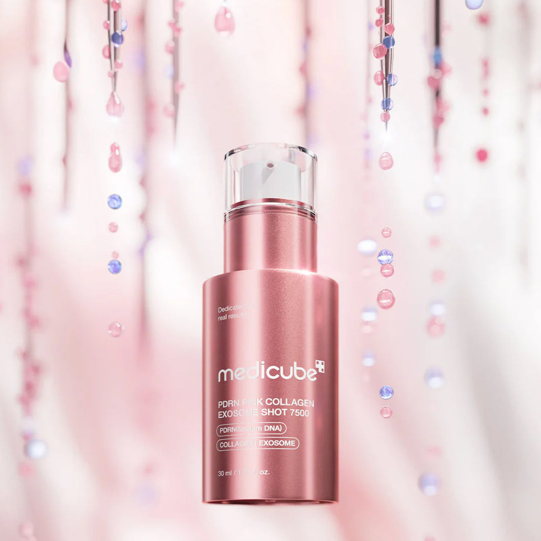 Pink skincare bottle with 'medicube' branding on a soft pink background with confetti.