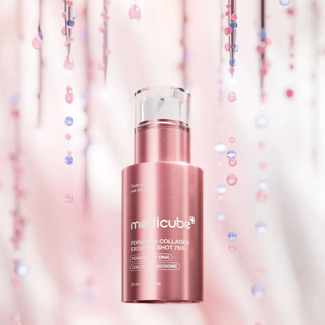 Pink skincare bottle with 'medicube' branding on a soft pink background with confetti.