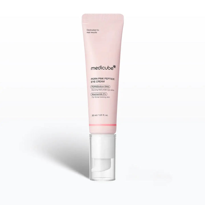 Pink eye cream tube with Medicube branding on a white background