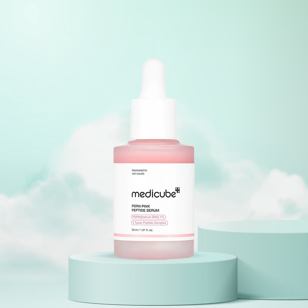 Medicube serum bottle on a light green background