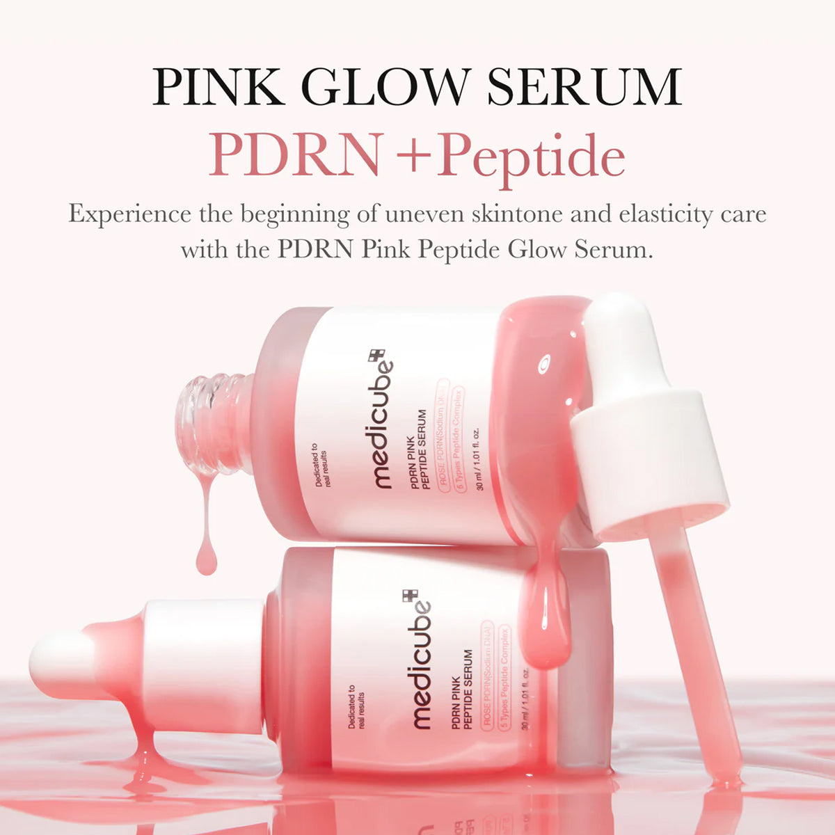 Pink glow serum bottle with dropper on a white background
