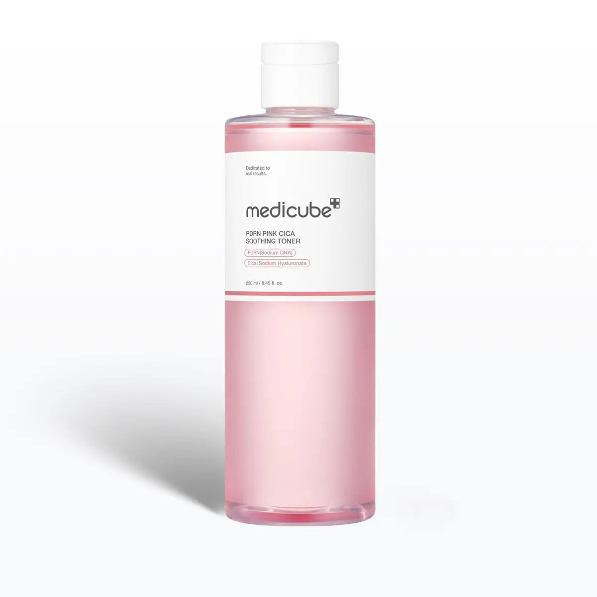 Medicube toner bottle with pink liquid on a white background