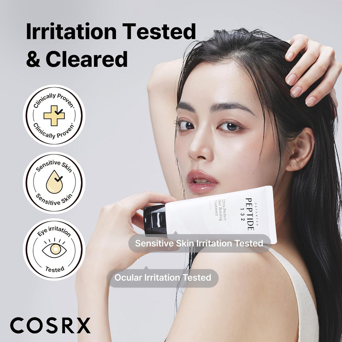 Woman holding a COSRX skincare product with irritation testing icons on a light gray background