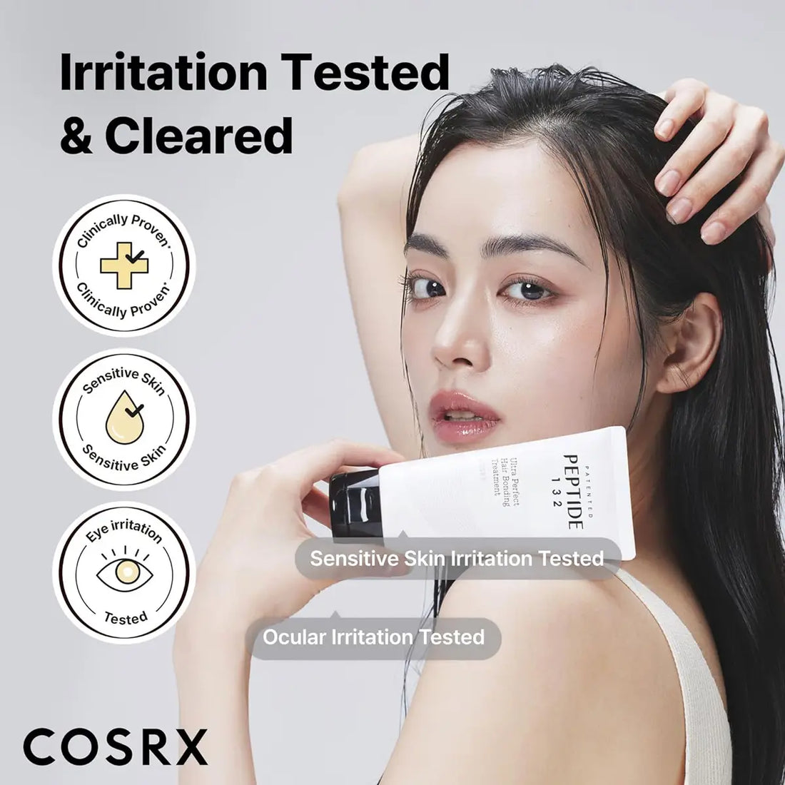 Woman holding a COSRX hair care product with irritation testing icons on a light gray background