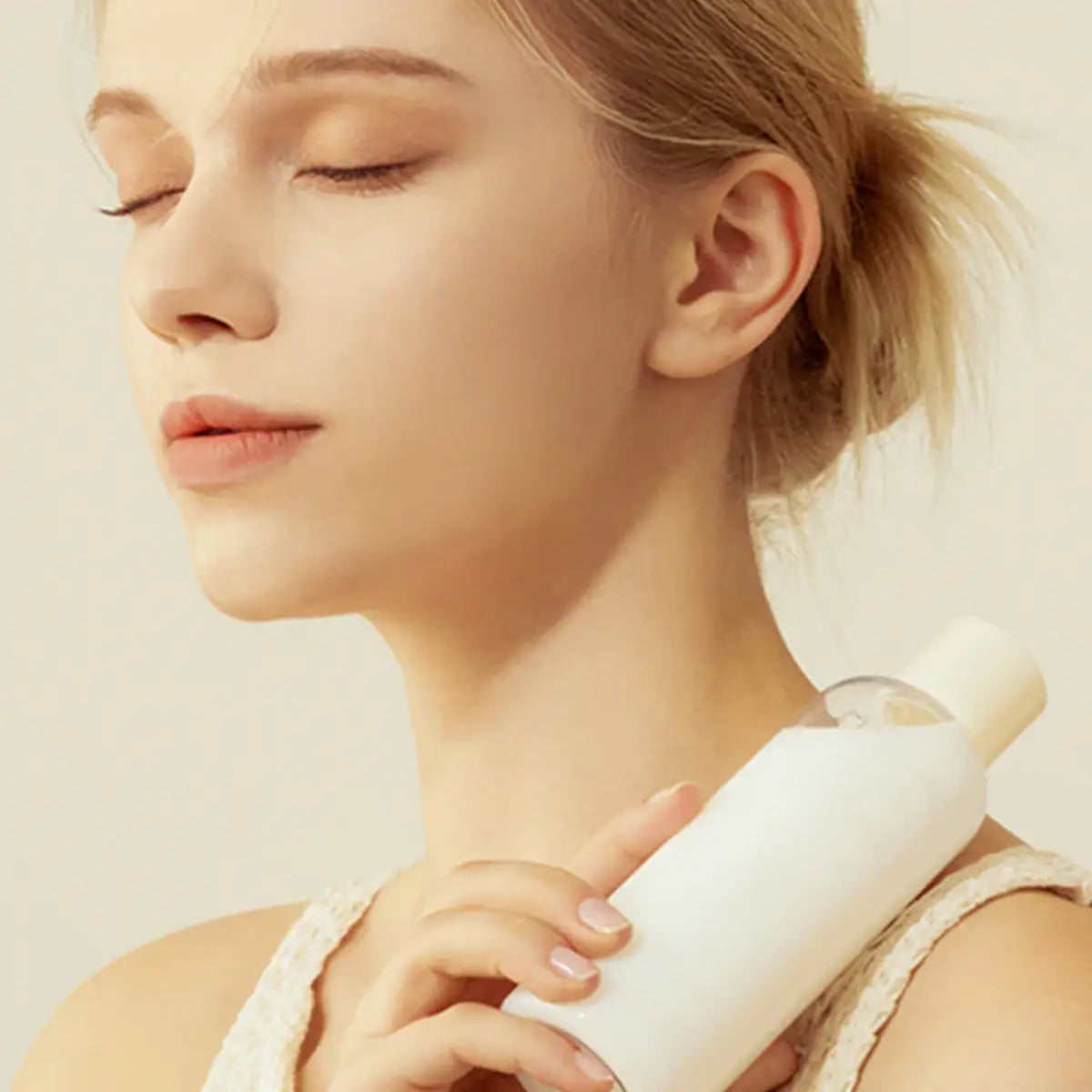 Woman holding a Purito Oat-in Silky Toner