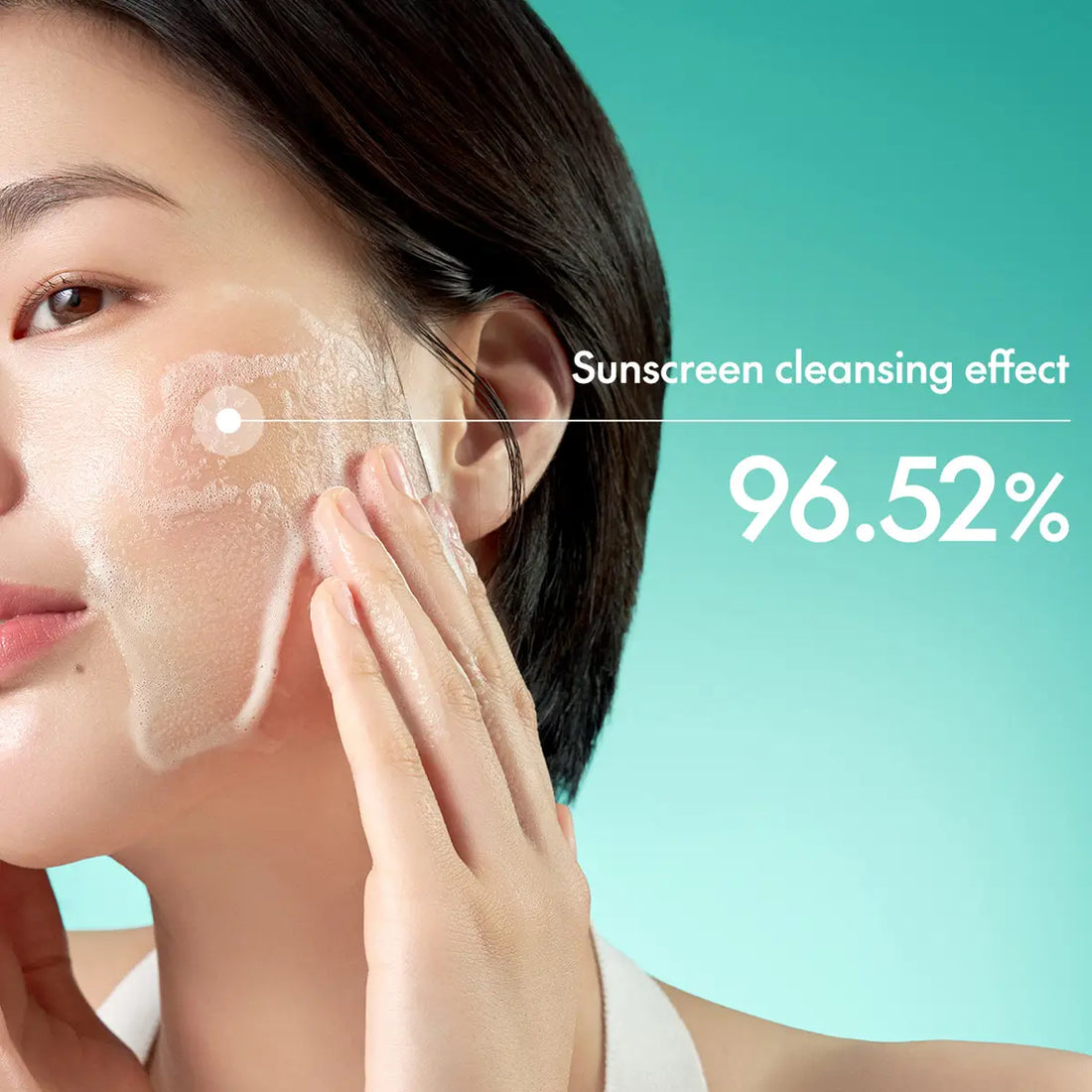 Woman applying sunscreen with text indicating 96.52% sunscreen cleansing effect on a teal background