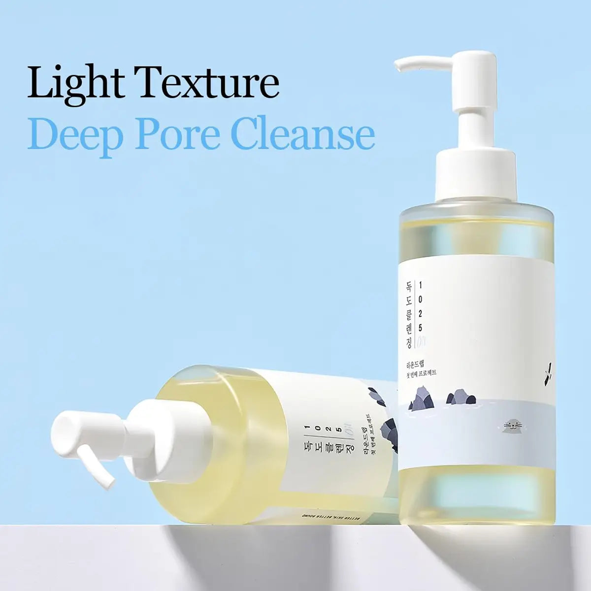 Two bottles of skincare product with pump dispensers on a light blue background, labeled 'Light Texture Deep Pore Cleanse'.