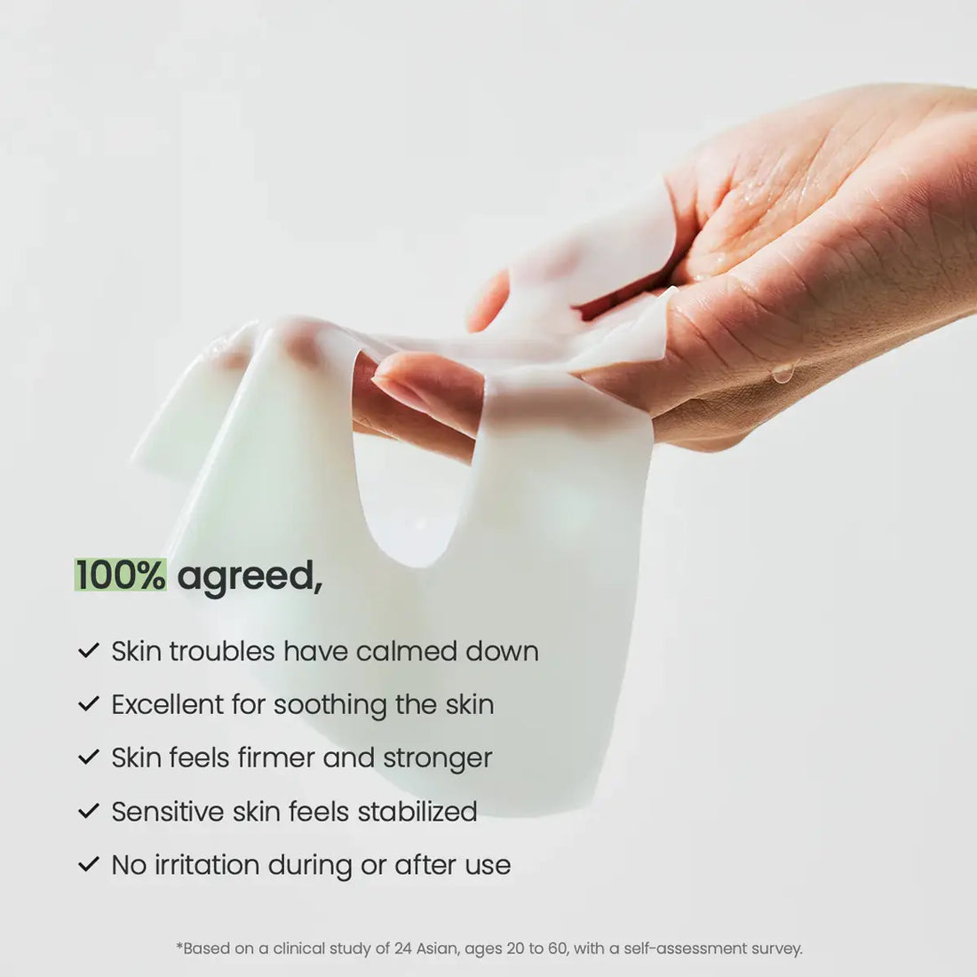 Hand holding a white Biodance sheet mask with text about skin benefits on a light gray background