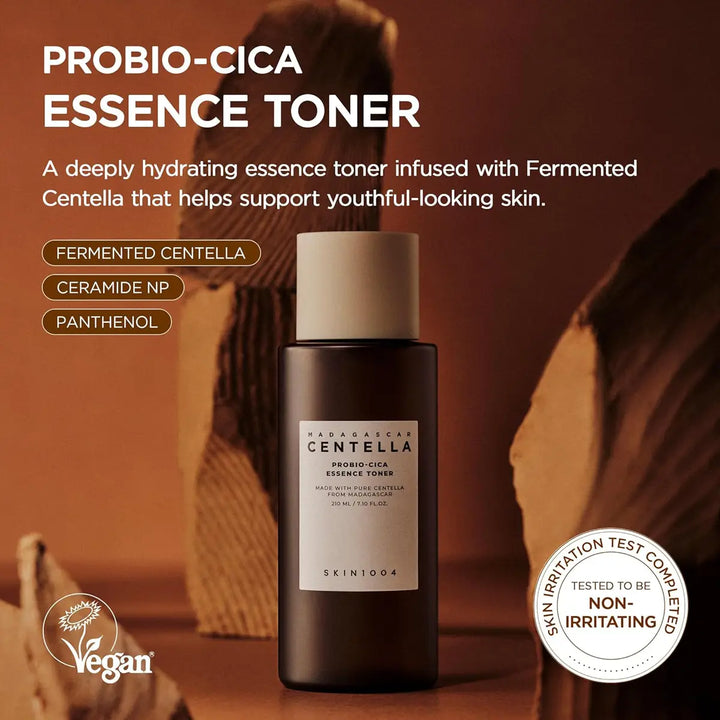 Probio-Cica Essence Toner bottle with product details and branding on a blurred background