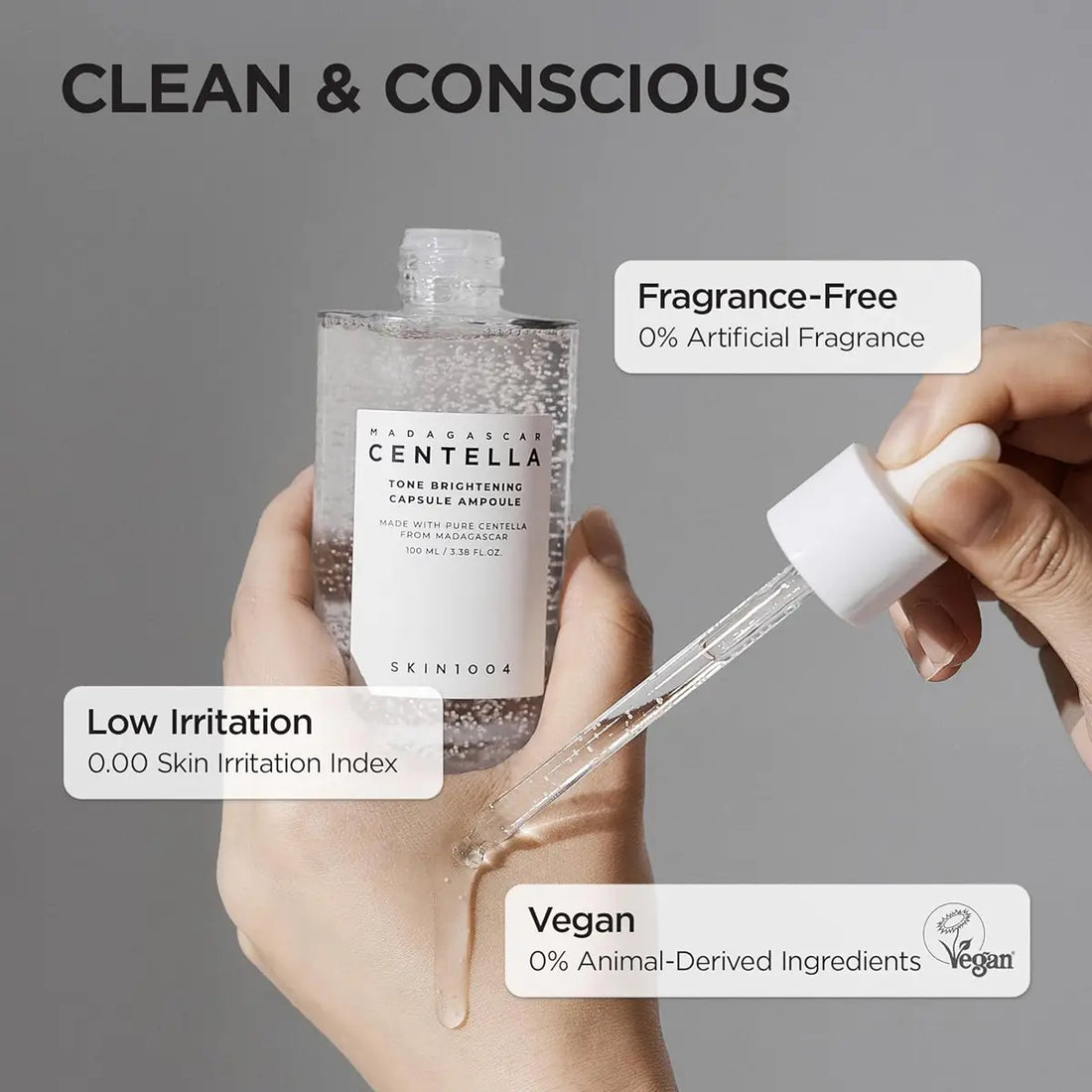 Hand holding a skincare product with dropper, labeled as fragrance-free, low irritation, and vegan.
