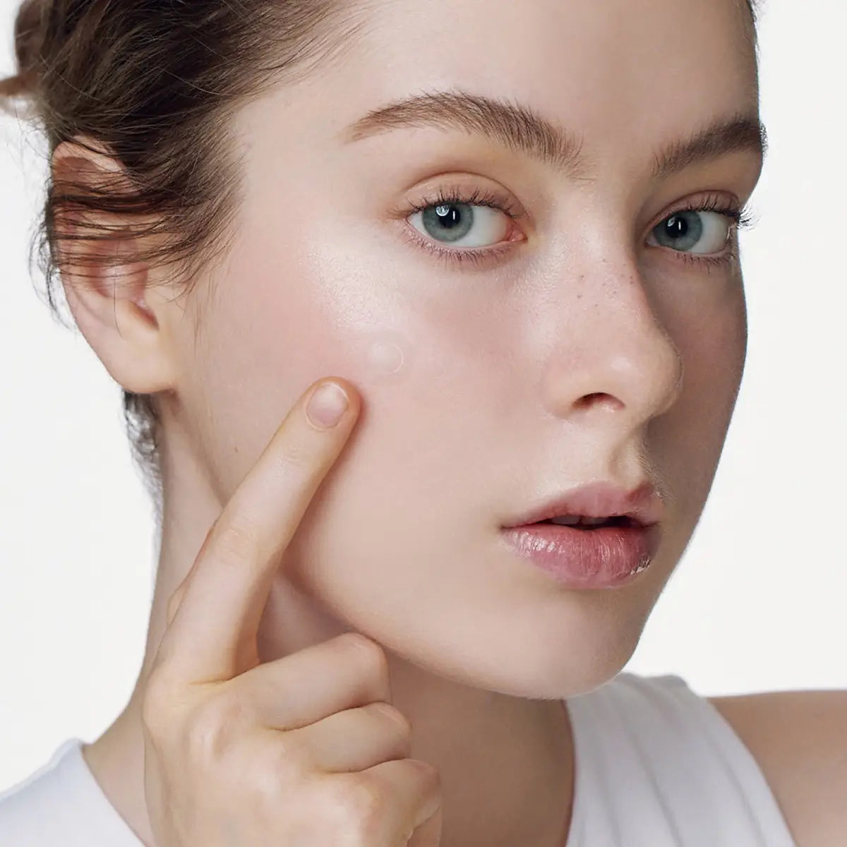 SOME BY MI Micro Pin Spot Patch 9 Pcs applied on a model's blemish for targeted acne treatment.