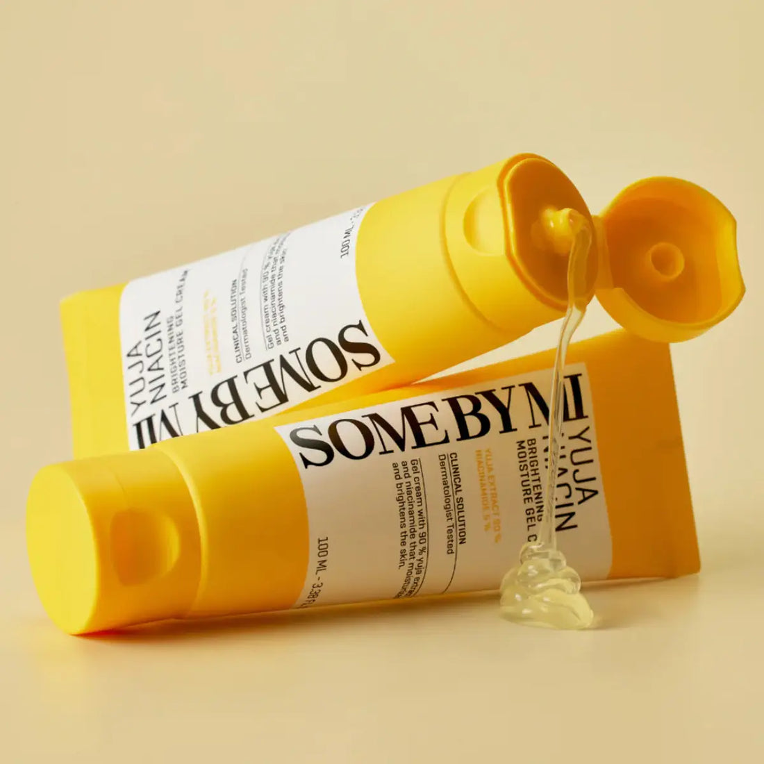 SOME BY MI Yuja Niacin Brightening Moisture Gel Cream 100mL in vibrant yellow packaging with gel texture oozing from tube.