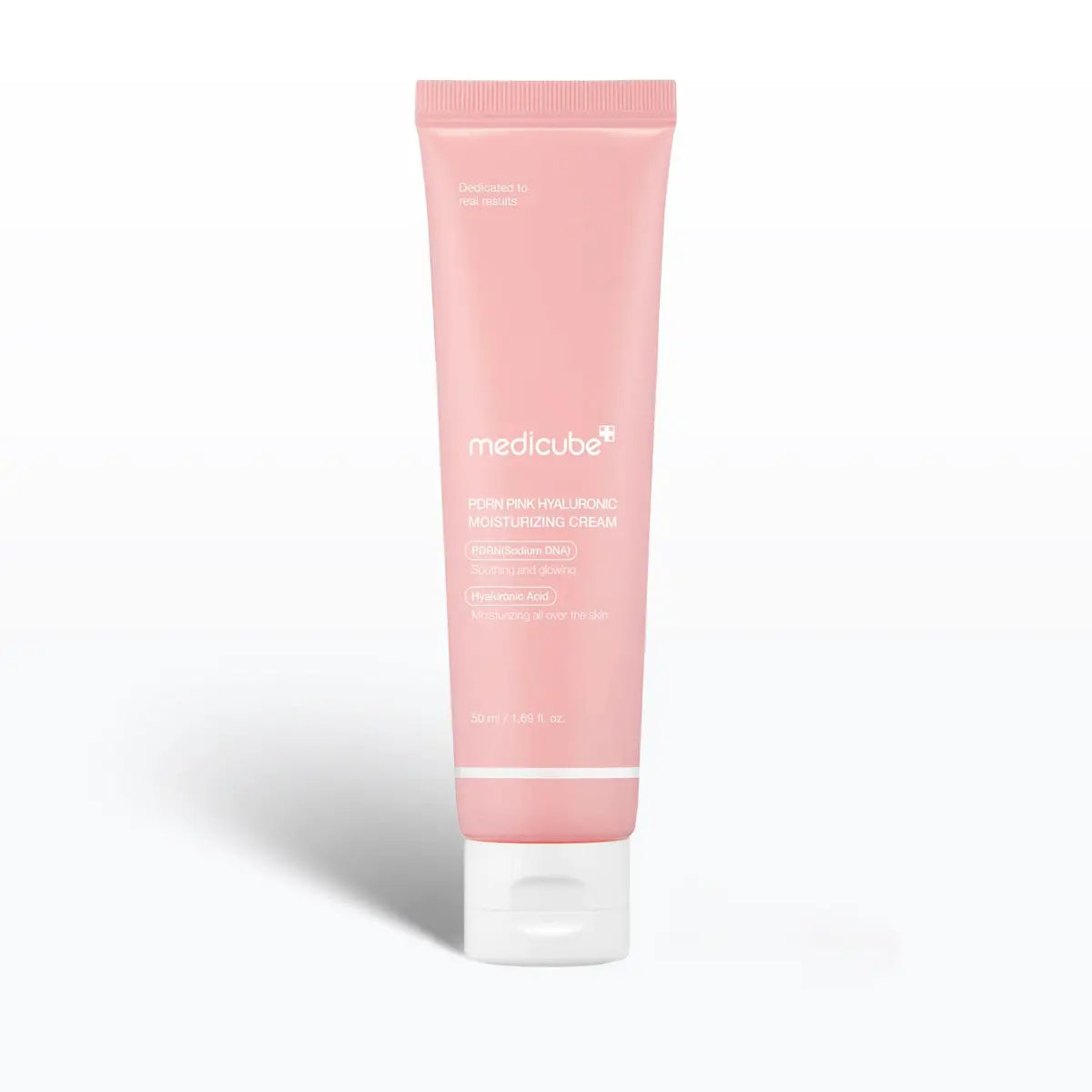 Pink tube of Medicube cream on a white background