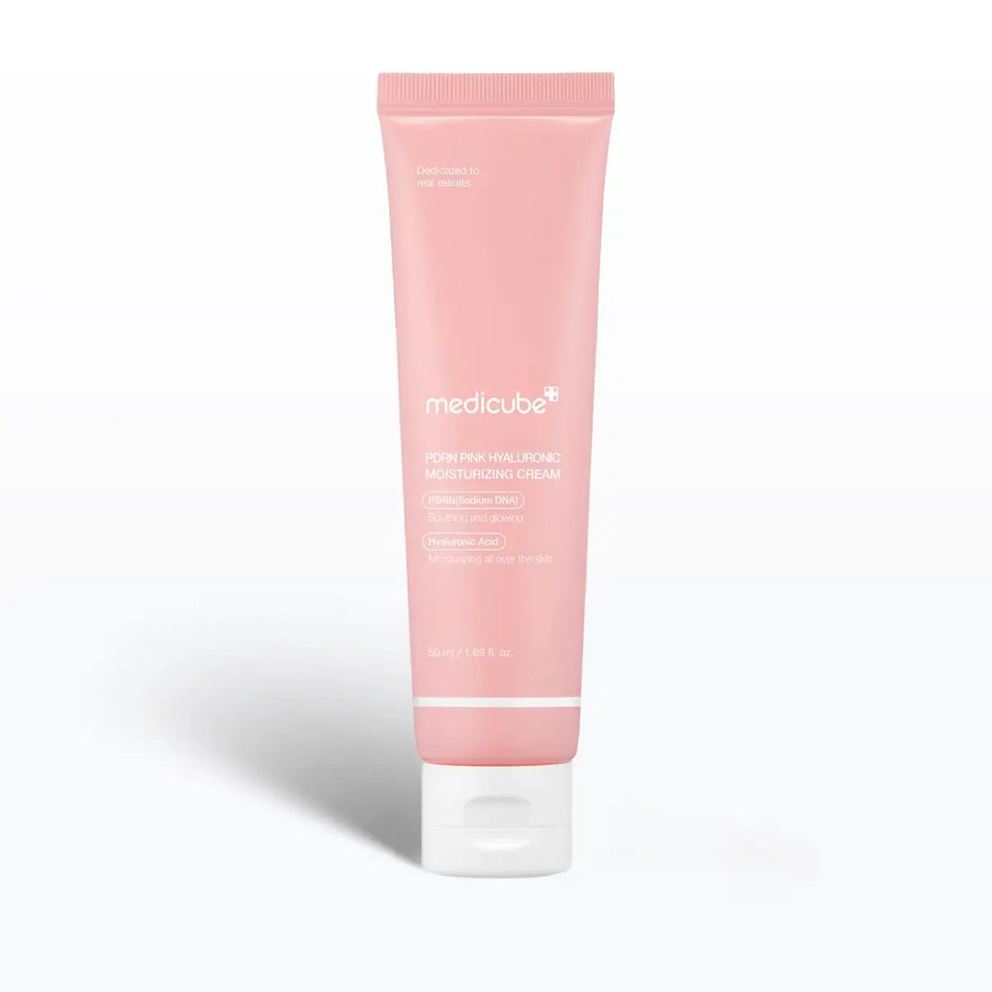 Pink tube of Medicube cream on a white background
