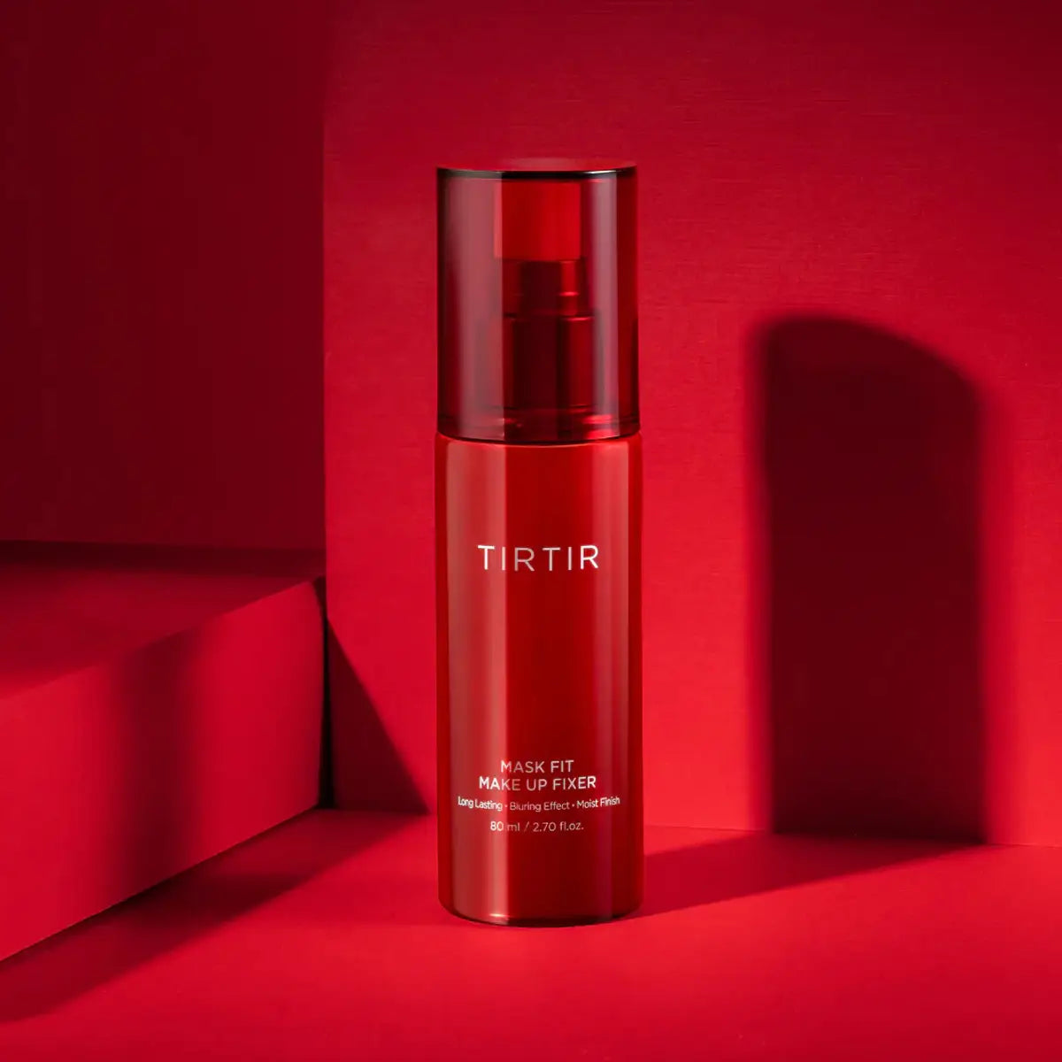 Red skincare bottle with 'TIRTIR' branding on a red background