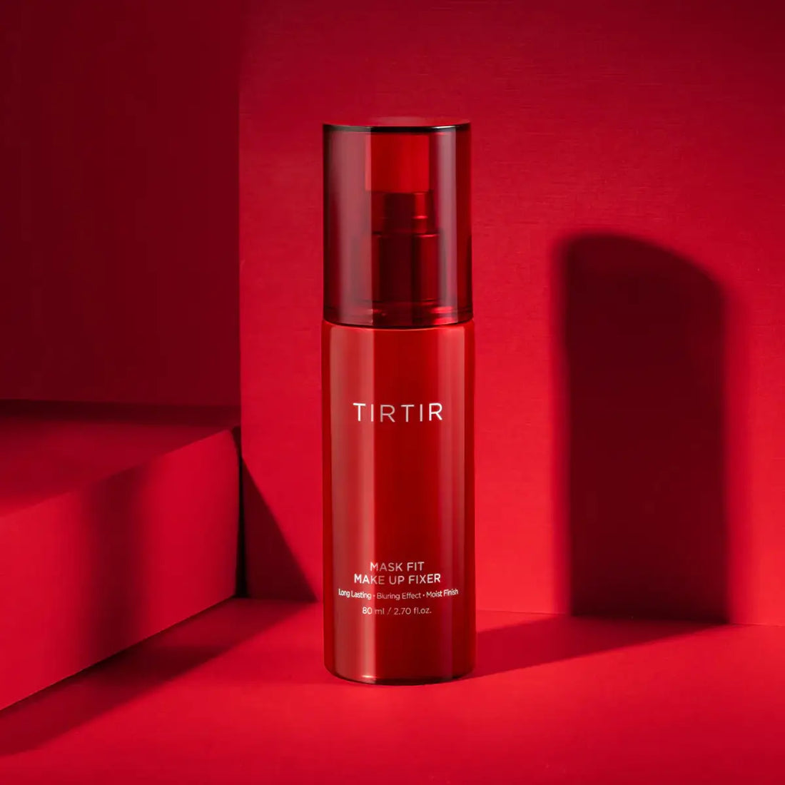 Red skincare bottle with 'TIRTIR' branding on a red background