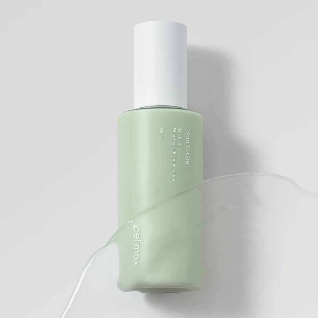 Green bottle with white cap on a light gray background