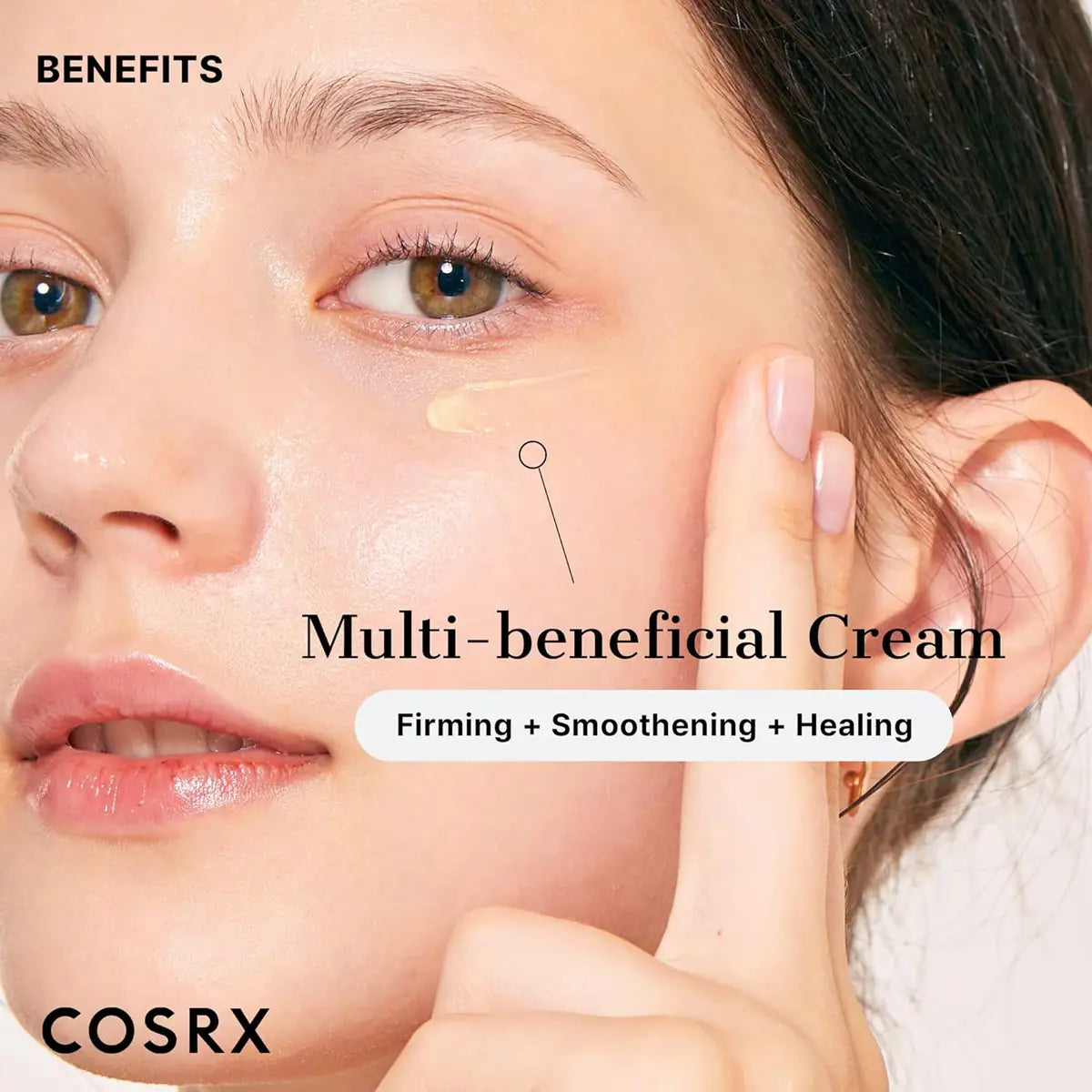 Woman applying multi-beneficial cream to her face with COSRX branding.