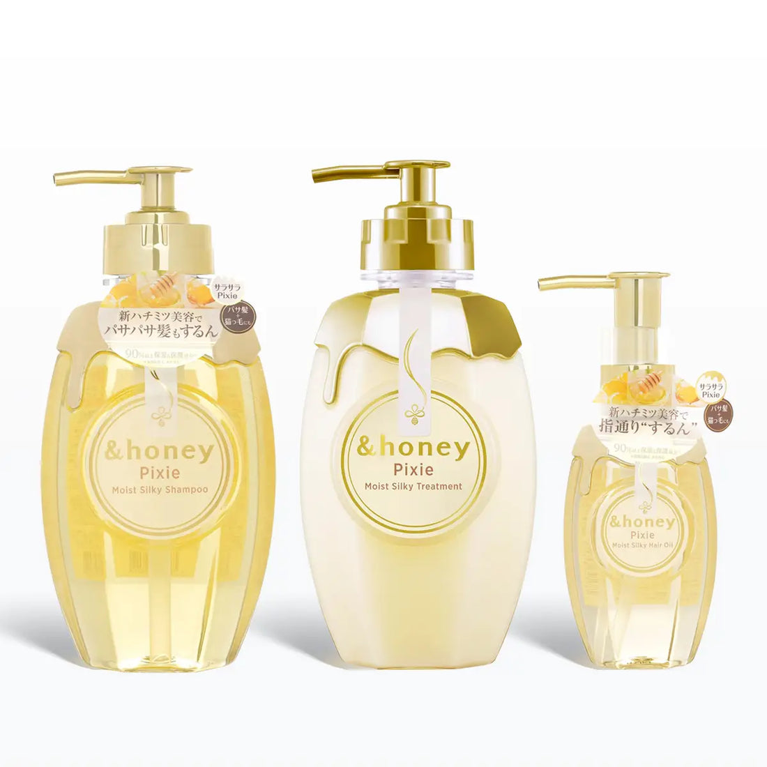 Three bottles of &honey Pixie hair care products on a white background