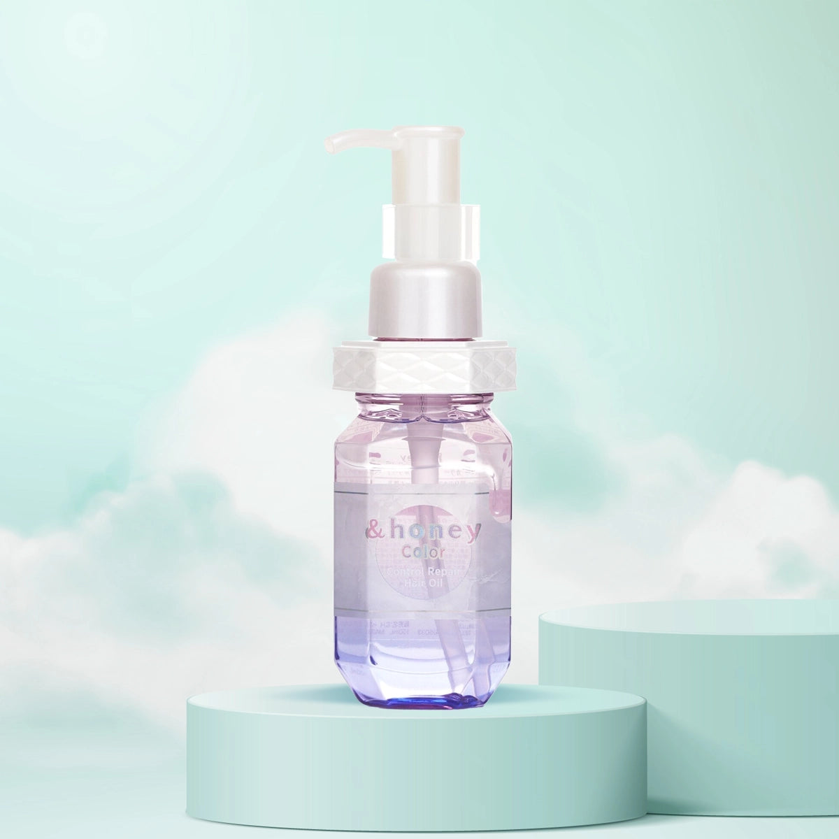A bottle of &Honey Color Control Repair Hair Oil with a pump dispenser, displayed on a teal pedestal with a light blue background, suggesting a nourishing and care-related product.
