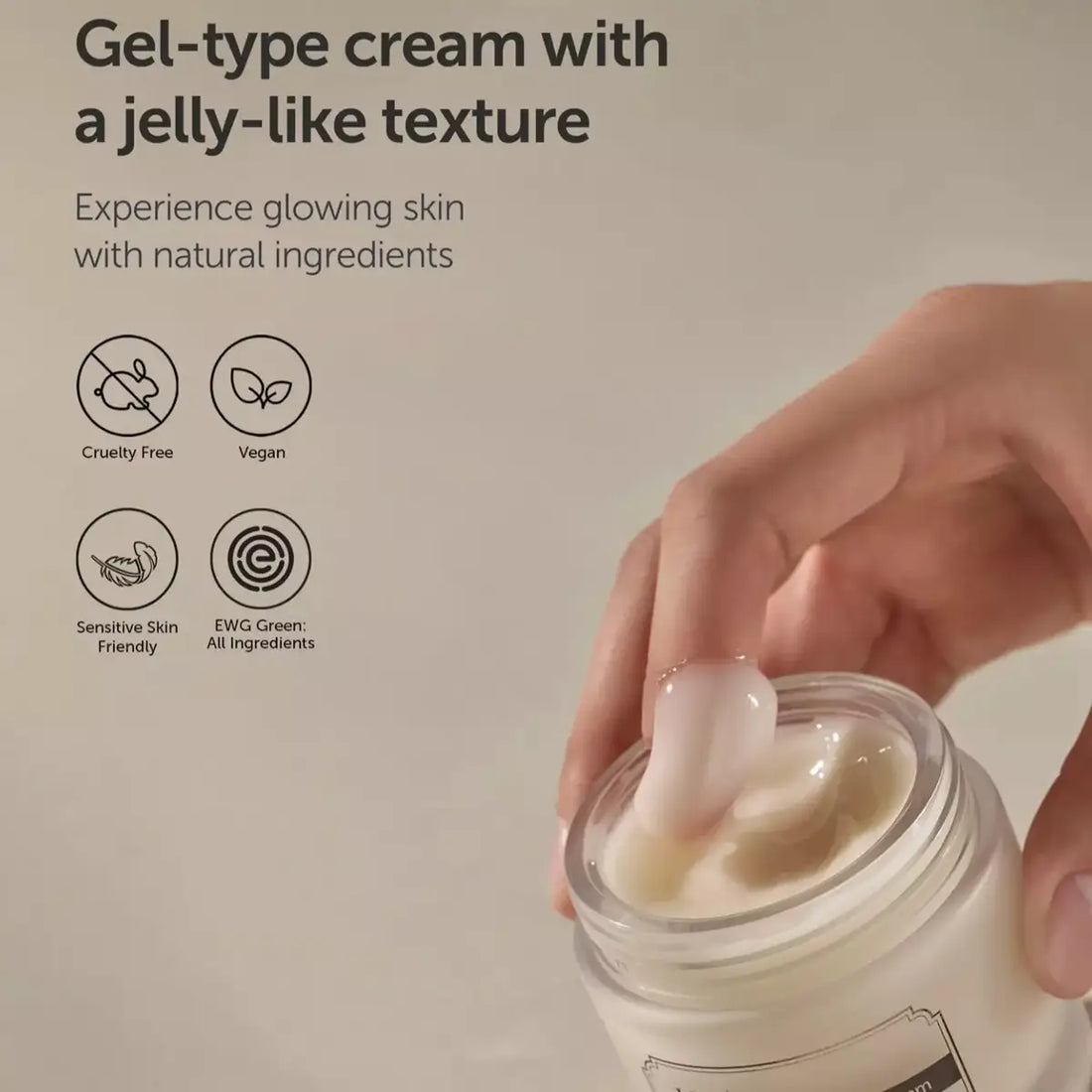Jar of gel-type cream with a jelly-like texture, held by a hand, on a beige background.