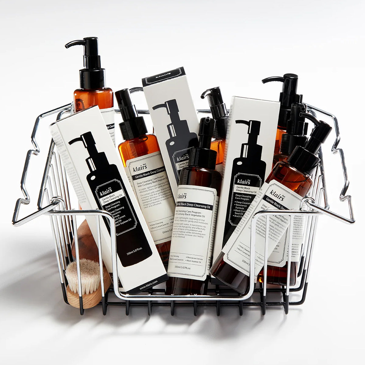 Collection of dear Klairs skincare and products in a metal basket on a white background
