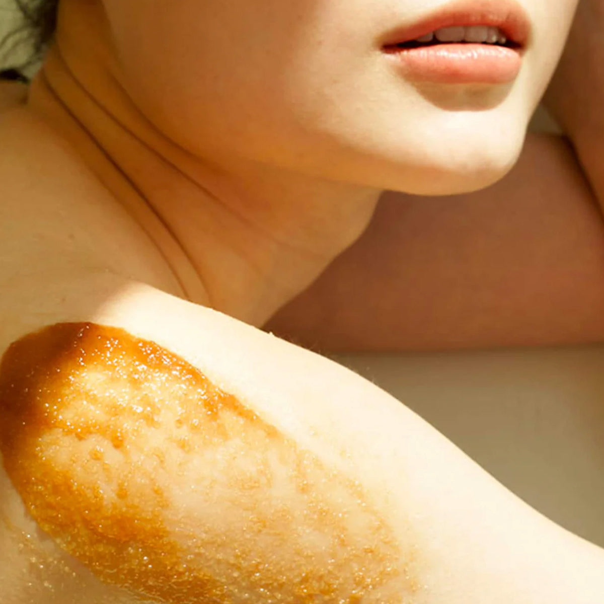 dear KLAIRS Gentle Black Sugar Facial Polish | Korean exfoliating scrub for smooth, Close-up of a person's arm with a sunburn on a neutral background