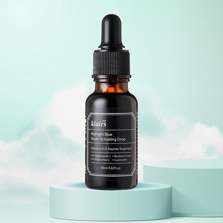 dear Klairs Midnight Blue Youth Activating Drop 20mL | Korean anti-aging serum for sensitive and oily skin in Dubai, UAE. on cloudy background