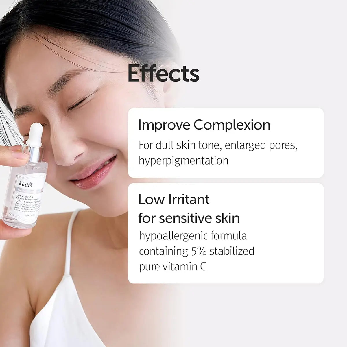 Woman holding a dear KLAIRS Freshly Juiced Vitamin Drop bottle with text about product effects on skin.