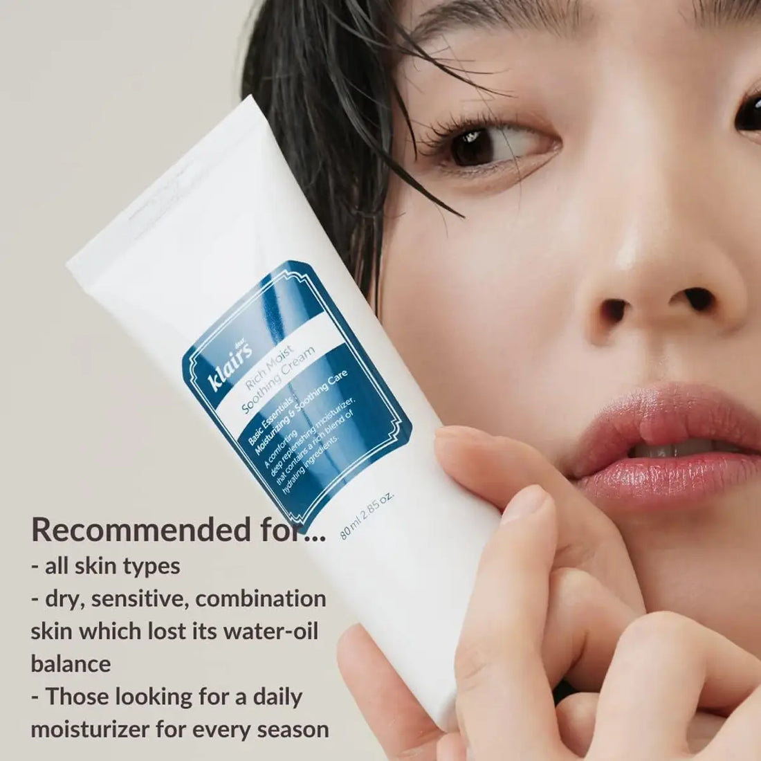 dear KLAIRS Rich Moist Soothing Cream  with a person holding it, on a neutral background