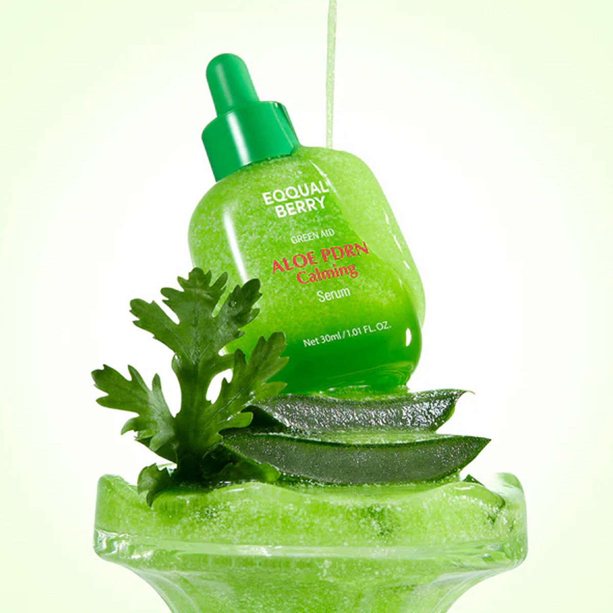 Aloe PDRN Calming serum bottle with leaves on a light green background